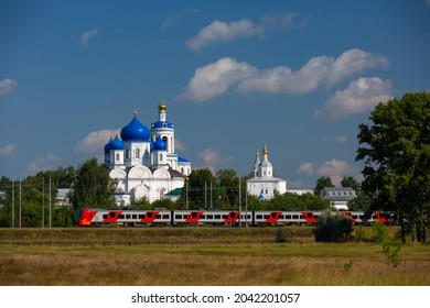 Train sweeps past the monastery in Bogolyubovo, Russia