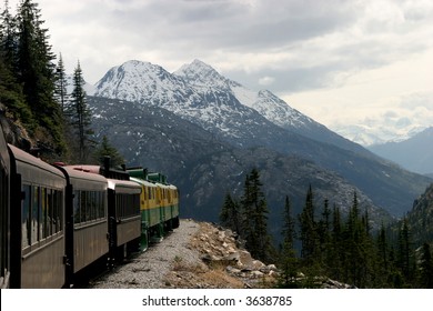 A Train Takes Tourists Through The Canadian Rockies And Alaska.