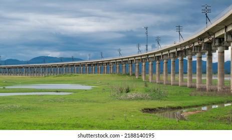 The Train Track Above The Lake Is Like Floating On The Water As Unseen, Light At The End Of The Train As A Success Or To Something Better.