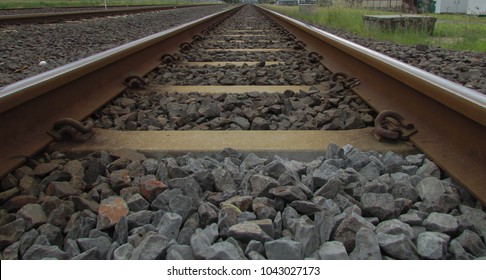 Train Tracks Closeup Taken From A Low Angle With A Forced Perspective