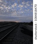 Train tracks and clouds.