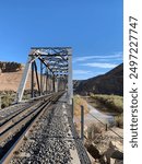 Train tracks crossing the Mojave River in remote Afton Canyon