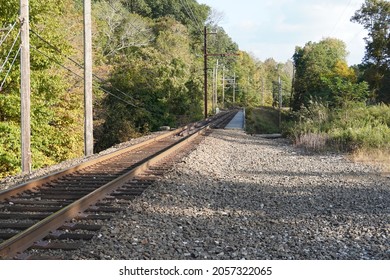 Train tracks crossing a ravine and river - Powered by Shutterstock