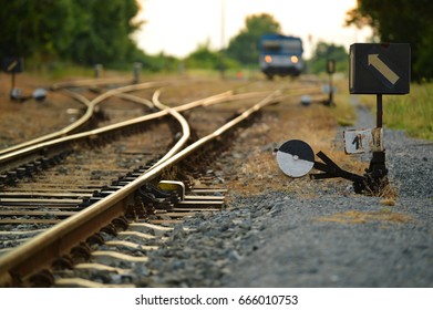 Train With Train Tracks And Switch In The Evening Light