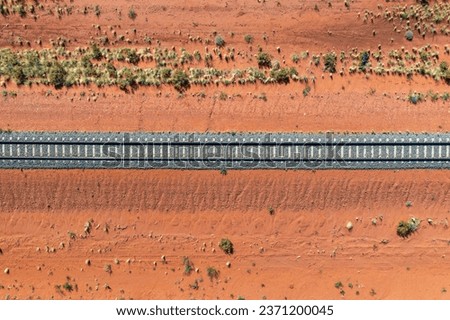 Train tracks through the red centre of outback Australia