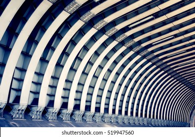 Train tunnel. Symmetric steel beams pattern. Abstract architecture, construction, transportation and travel concept