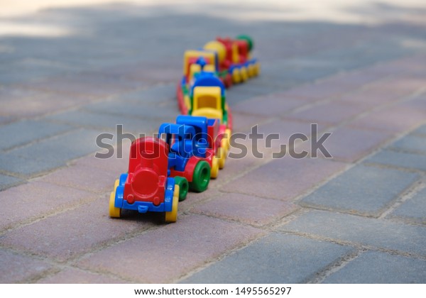 A\
train of various cars. A multi-colored toy train that rides towards\
adventure. A happy childhood without the\
Internet.
