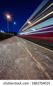 A Train From VY Is Leaving Station In Norway With Motion Blur