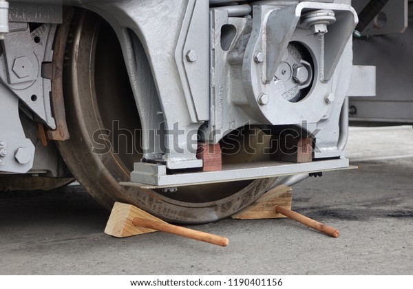 Train wheel with\
wooden chocks for safety