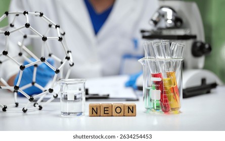 A trained scientist conducts experiments with neon gas, test tubes, and molecular models in a equipped lab