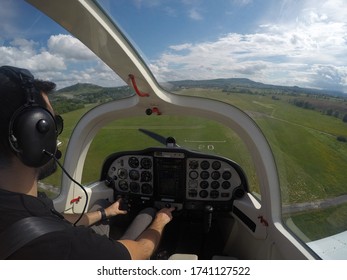 Trainee Pilot Approaching To A Grass Runway. Shallow Depth Of Field.