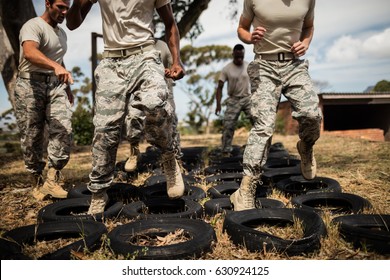 Trainer giving training to military soldiers at boot camp - Powered by Shutterstock