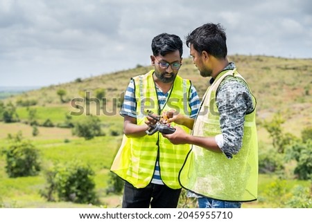 Trainer teaching by explaining about drone operations to student - Concept drone or UAV pilot training
