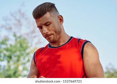 trainer young man looking at the camera with a beautiful body