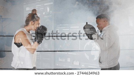 Training boxer in white top throwing punches at trainer in grey hoodie, black gloves, mitts, HUD. Boxing, ring, gym, coach, overlay, ar, analytics