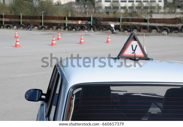 Training in the car park for the exam for a\
driving license