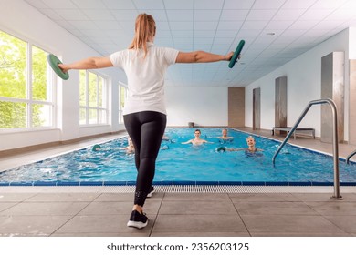 Training class in water gymnastics at a rehabilitation gym - Powered by Shutterstock