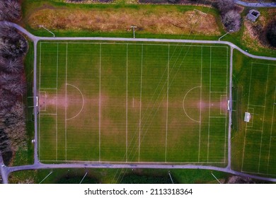 Training Field With Tall Goal Posts For Irish National Sport, Camogie, Hurling, Rugby, Gaelic Football. Aerial Drone View. Green Grass Field For To Practice Active Games.