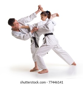 Training fight.two fighters on a white background.hand-to-hand fighting.man and woman.punch.karate