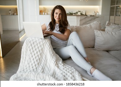 Training at home. The brunette woman smiles. Place to copy. portrait a foreign language teacher conducts a lesson remotely online conference with students via a video communication app. - Powered by Shutterstock