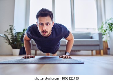 Training At Home. Closeup Of Man Doing Pushups At Home