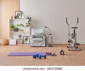 Training At Home Concept, Interior, Decorative Sport In The Room With Gym Fitness Exercise Purple Mat, Dumbbell And Bicycle.