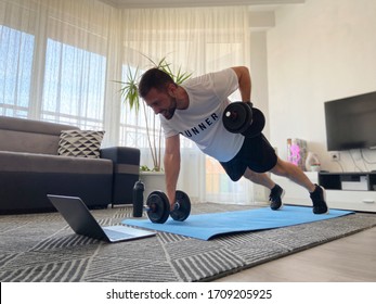 Training At Home. Man With Smartwatch Doing Workout At Home In Front Of Laptop - Healthy Lifestyle Modern Concept.