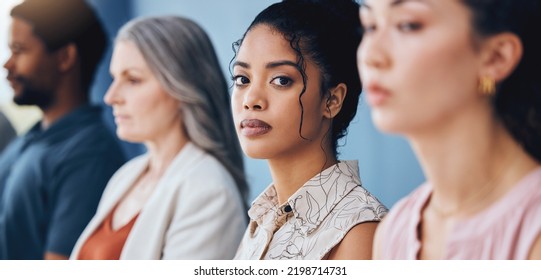 Training, learning and education with a business woman looking serious and sitting in a conference or workshop for coaching. Portrait of a female employee in an audience for a development seminar - Shutterstock ID 2198714731