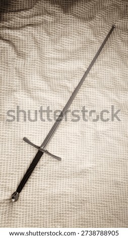 Training longsword lying on the bed