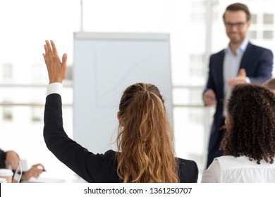 Training Participant Raise Hand Ask Question Get Engaged Involved In Voting Initiative At Employees Team Workshop, Corporate Knowledge, Business Education, Volunteer Participation Concept, Rear View