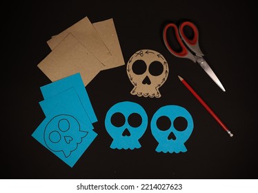 Training Picture How To Make A Skull Figurine For The Halloween Holiday In The Picture Details Of What To Make A Blue Skull. Cardboard Blue Paper Scissors And A Black Pencil For Marking And Figurines 