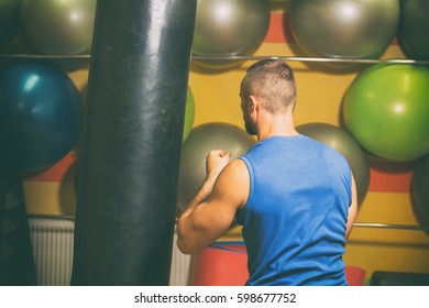 Training process men at the gym