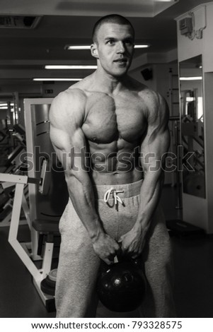 Training process men at the gym