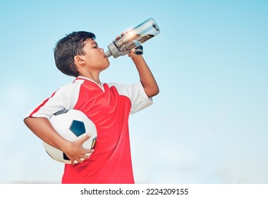 Training, sports and football with child drinking water for fitness, health or endurance exercise. Wellness, summer and workout with young soccer player and bottle for electrolytes, relax and thirsty
