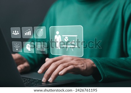 Training webinar E-learning concept. Business training, training for learn, skill, productivity, capacity building, knowledge, development. Person use laptop with training icon on a virtual screen. 