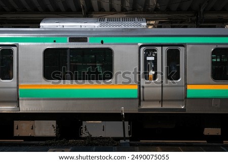 Similar – Image, Stock Photo Passenger train is arrived to railway platform station, people walking in hurry, Sun in backlight