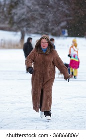 TRAKAI, LITHUANIA - JANUARY 7, 2016: Mature Woman Ice Skating In Winter Rink. Skating Involves Any Activity Which Consists Of Traveling On Ice Using Skates