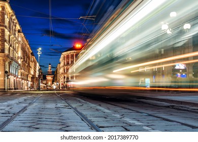 tram in motion blur passing on a shopping street in the center of Milan in Italy
