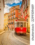 tram on narrow street of Alfama, Lisbon, Portugal