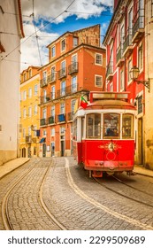 tram on narrow street of Alfama, Lisbon, Portugal