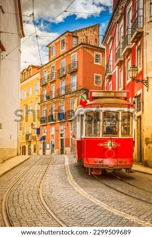 tram on narrow street of Alfama, Lisbon, Portugal