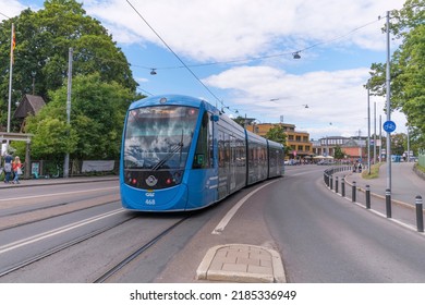 Tram Passing The ABBA Museum And Tivoli Platform On The Way To The Central Station T Centralen, A Sunny Summer Day In Stockholm, Sweden 2022-07-30