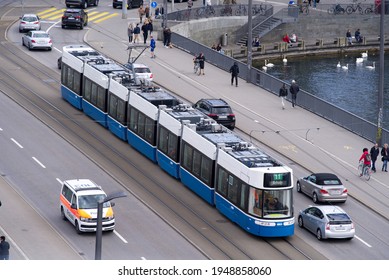 Tram And People At Bellevue Square At City Of Zurich. Photo Taken April 3re, 2021, Zurich, Switzerland.