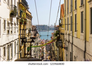 Tram street and sea in the background in Lisbon, Portugal