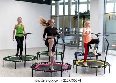 Trampoline for fitness girls are engaged in professional sports, the concept of a healthy lifestyle jumping trampoline woman fitness sport training, from workout active in lifestyle from body trainer - Shutterstock ID 2129736074