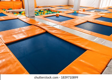 Trampolines for children in the sports center. Soft trampolines for high jumps and acrobatics. Children's entertainment. Children's sports and Hobbies. Sports hall interior.