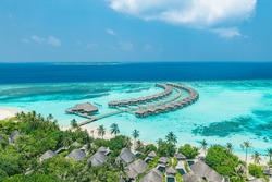 Tranquil Aerial Landscape, Luxury Tropical Resort With Water Villas. Beautiful Island Beach Palm Trees Sunny Sea Sky. Amazing Bird Eyes Panoramic Maldives Paradise Coast. Exotic Vacation Travel Beach