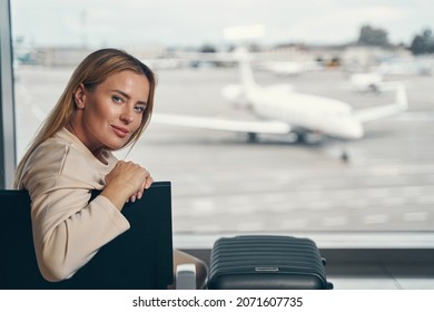 Tranquil Airline Passenger Seated In Waiting Area