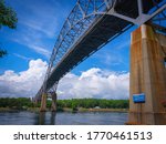 Tranquil cloudscape over the Bourne Bridge on Cape Cod Canal in a summer afternoon