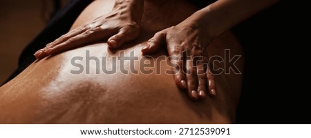 In a tranquil environment, a skilled practitioner delivers a soothing massage, focusing on relaxation and stress relief. The warm ambiance enhances the overall experience of comfort.